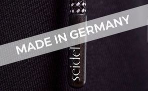 Handarbeit in jeder Naht