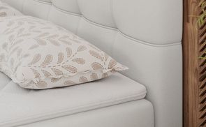 Komfortabler Schlaf: Gepolstertes Bett mit Topper