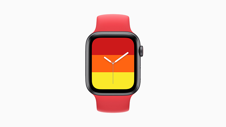 Die Apple Watch SE mit grauem Gehäuse, Solo-Loop aus Gummi in Rot und Stripes-Ziffernblatt.