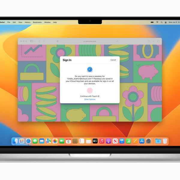 Auf einem aufgeklappten MacBook wird der Hinweis zur Anmeldung via Passkey angezeigt.