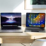 Ein MacBook Pro und ein iPad Pro stehen nebeneinander auf einem Tisch.